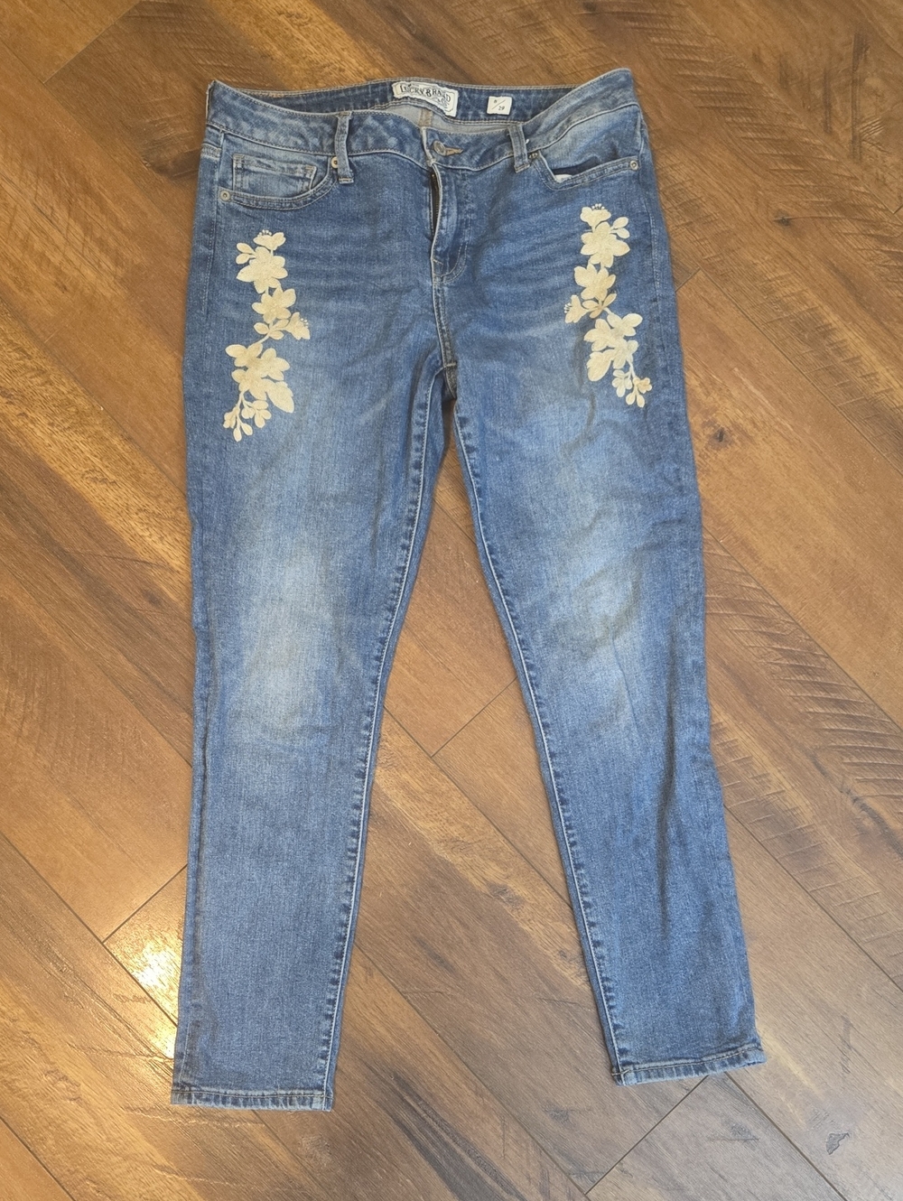Lucky Brand Blue Skinny Jeans with Cream Floral Appliqué